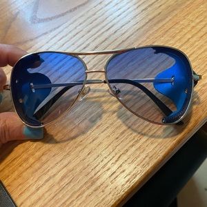 Sunglasses with leather side shield